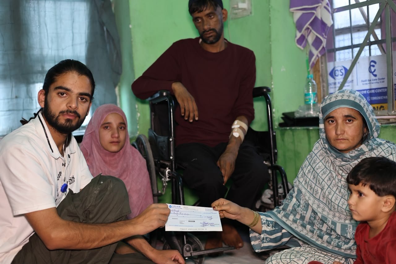 Volunteers distributing food and essential supplies at a community event